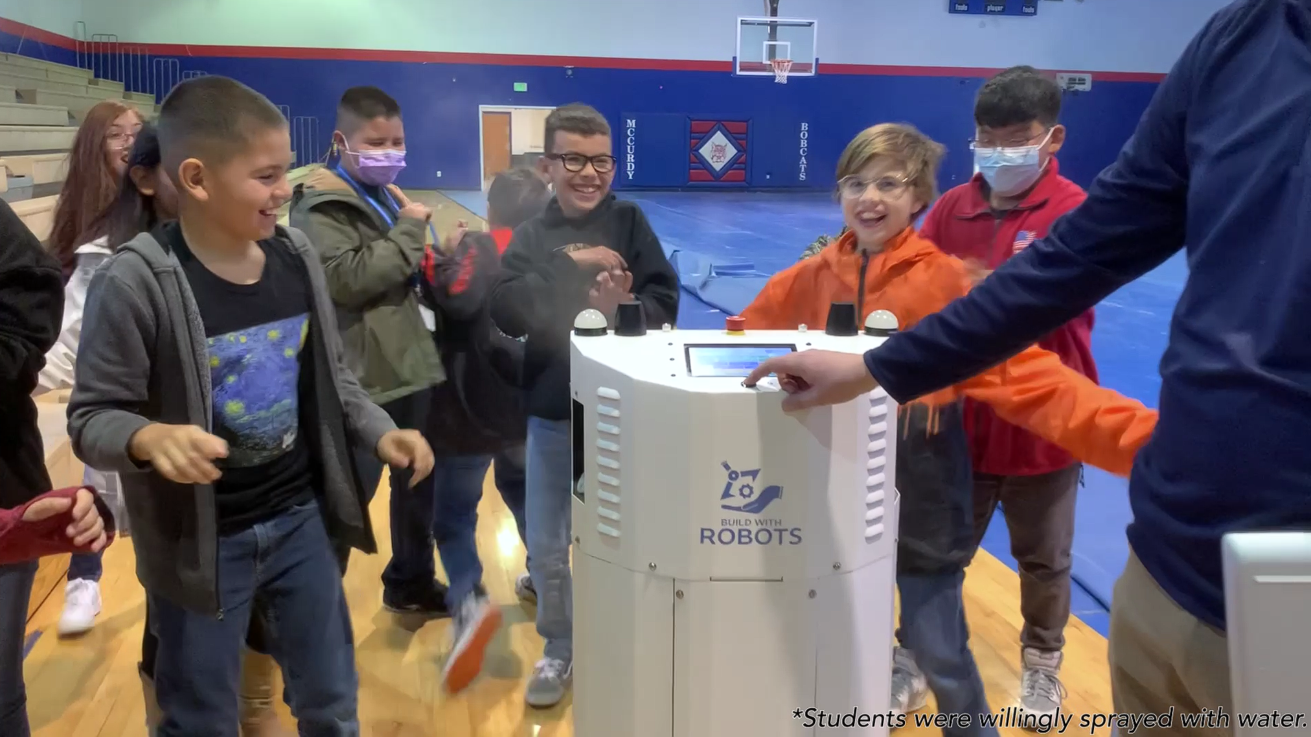 Students and Disinfecting Robot at McCurdy Charter